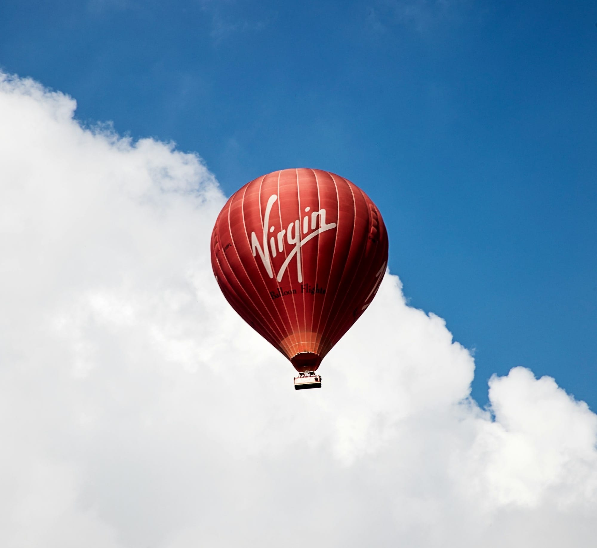 time lapse photography of flying Virgin hot air balloon